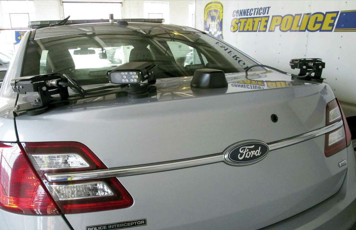 In this May 27, 2016 photo, license plate reading cameras are mounted on the back of a Connecticut State Police cruiser in Hartford, Conn.