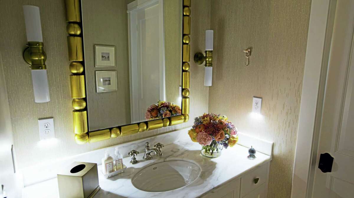 Two SnapPower Guidelights are displayed in this bathroom, but one is enough to get the job done.
