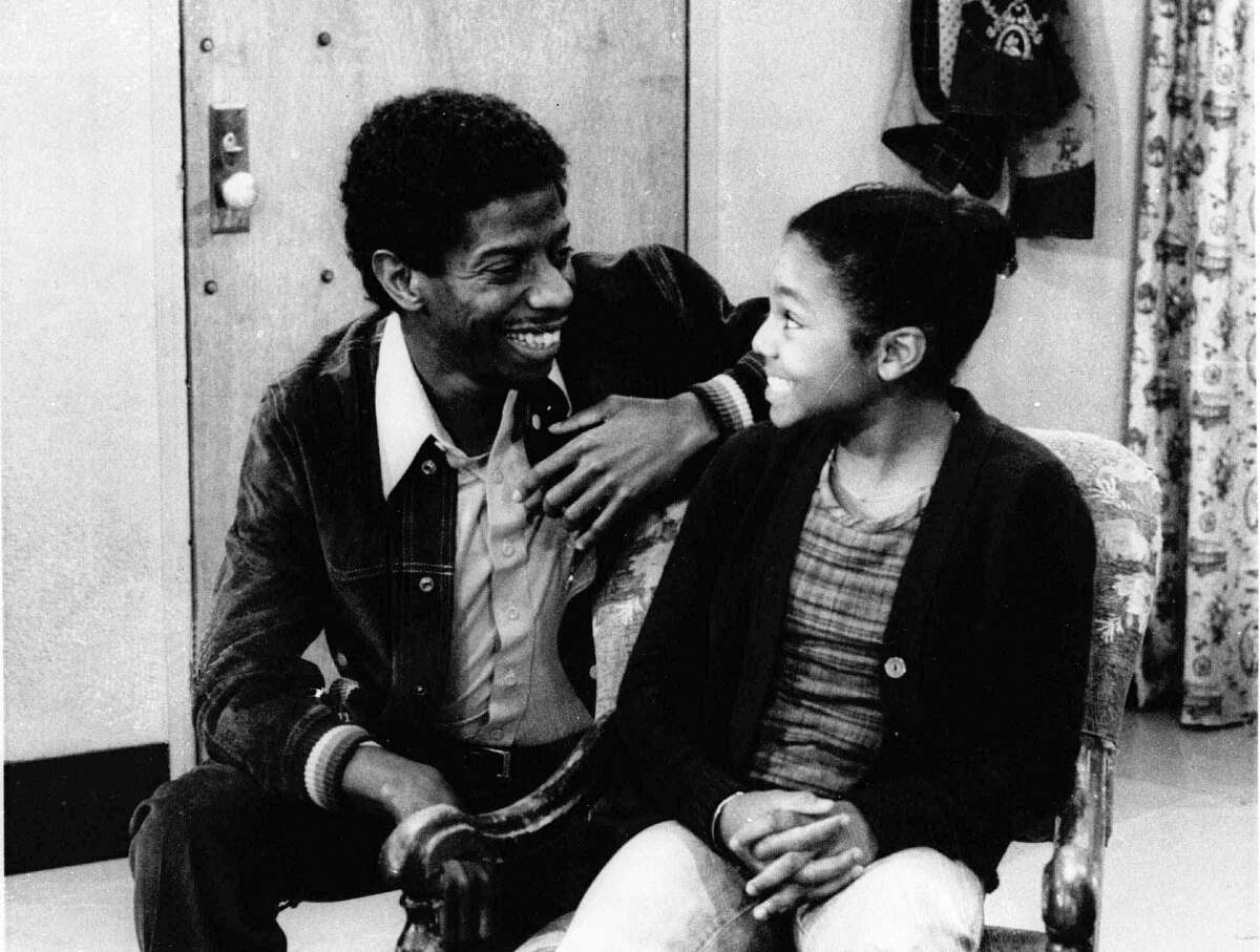 In this Sept. 28, 1977 photo, Jimmie Walker, left, appears with co-star Janet Jackson in an episode of “Good Times.” In the 1970s, Norman Lear was unveiling a slate of hit sitcoms that addressed hot-button issues of the day, particularly racial equality as depicted in “Sanford and Son,” “Good Times” and “The Jeffersons.”