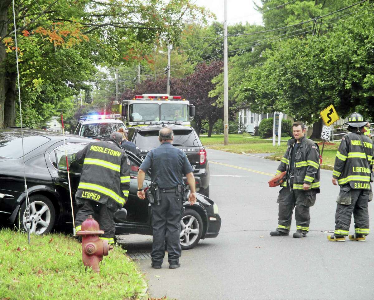 Middletown firefighters helped paramedics tend to a man and woman Friday after an accident at Warwick and High streets.