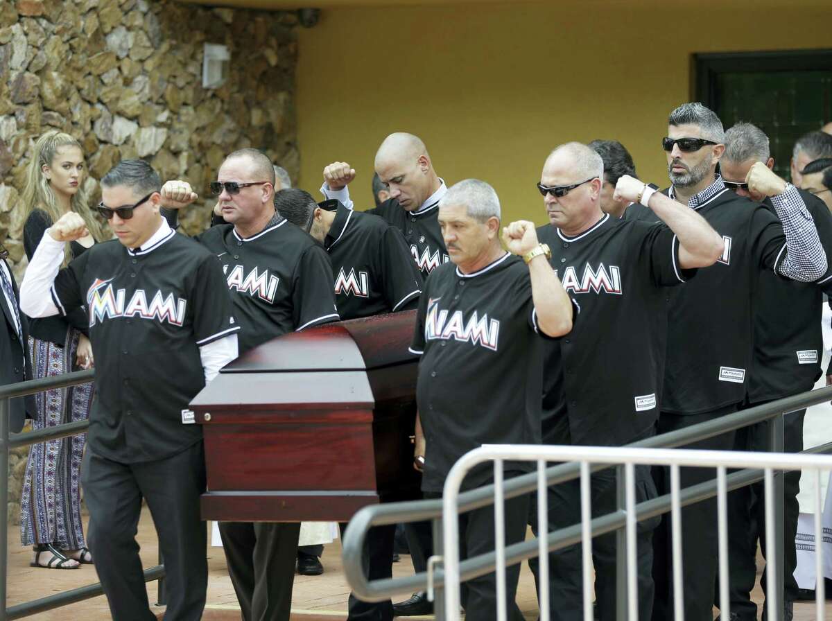 Pallbearers wearing Miami Marlins jerseys carry the casket of Miami Marlins pitcher Jose Fernandez, after a memorial service at St. Brendan’s Catholic Church, Thursday in Miami.