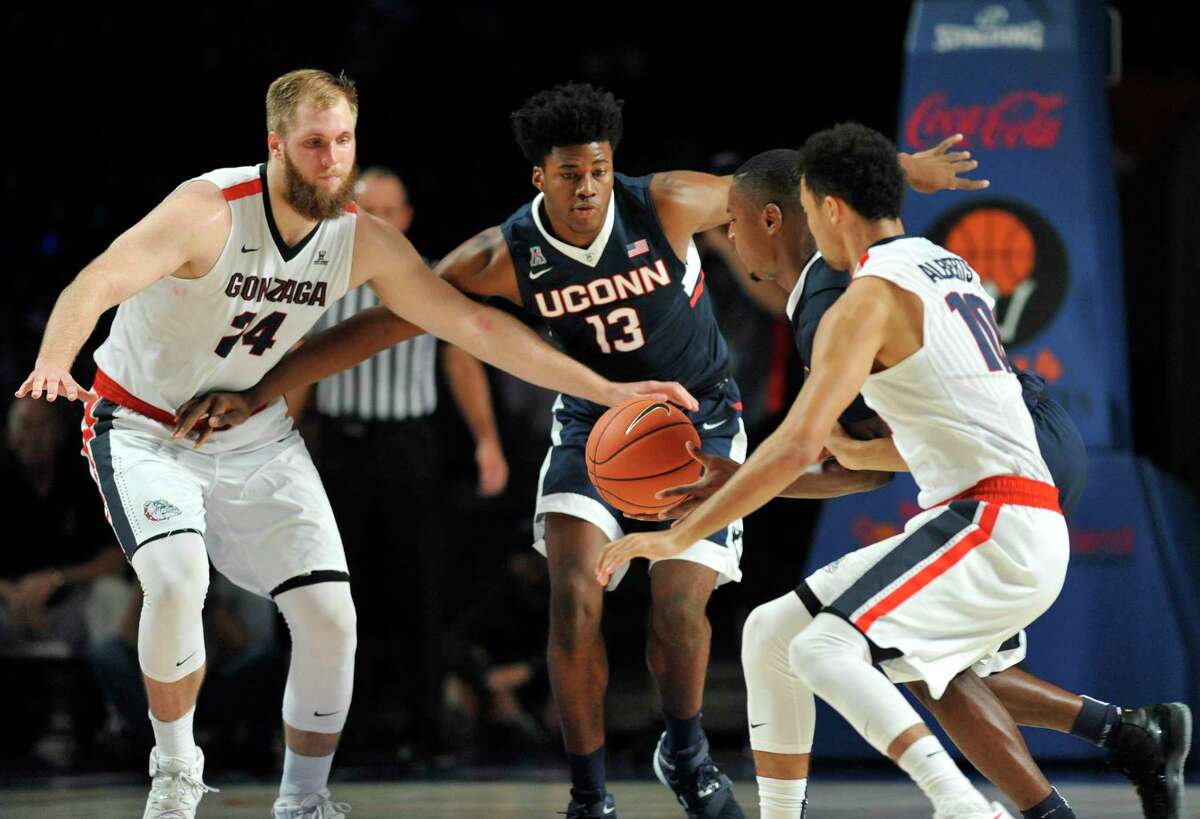 Connecticut forward Steven Enoch (13), seen with Connecticut guard Sterling Gibbs (4), Gonzaga guard Bryan Alberts (10) and Gonzaga center Przemek Karnowski (24), is applying for dual citizenship to play on the Armenian national team.