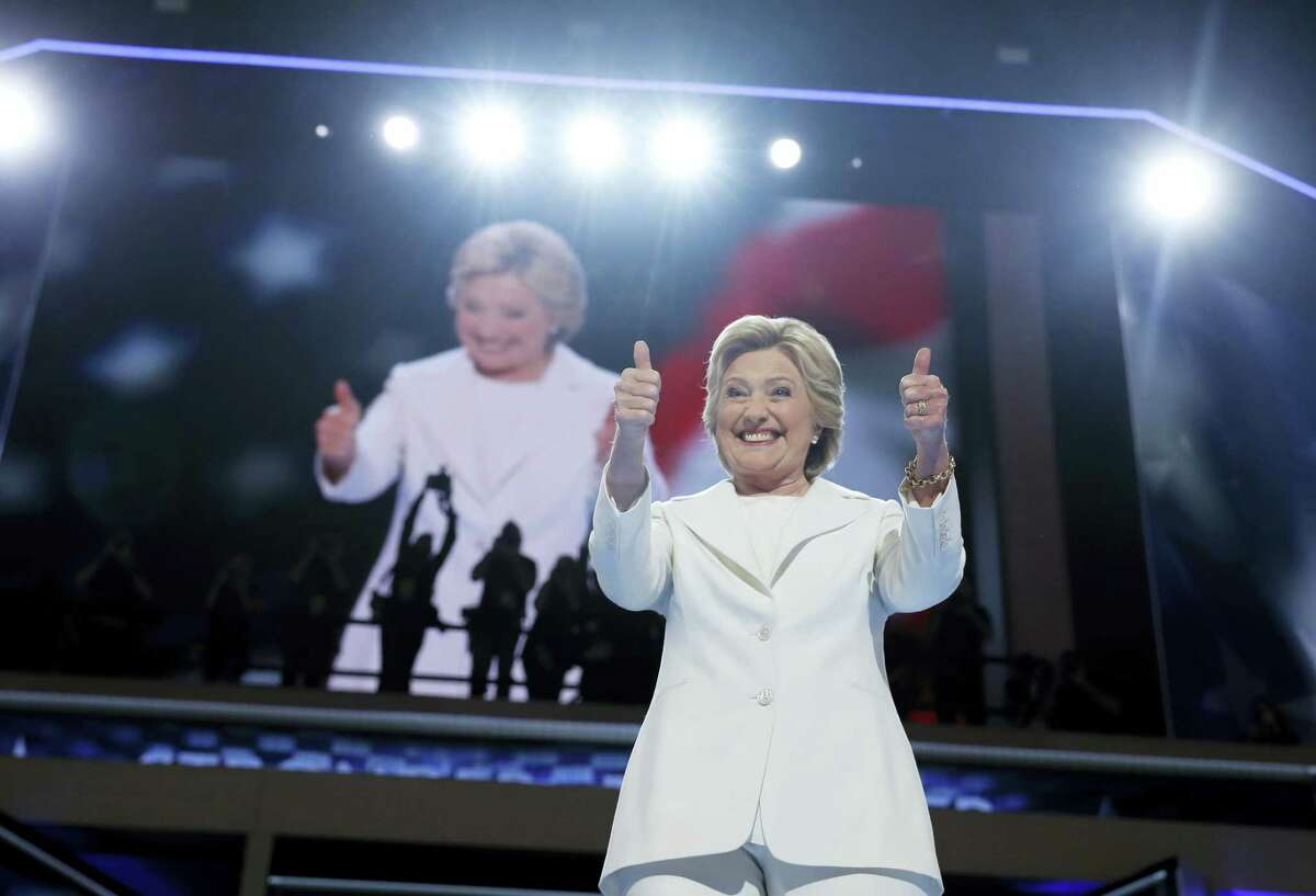 Democratic presidential nominee Hillary Clinton gives a thumbs-up as she appears on stage during the final day of the Democratic National Convention in Philadelphia Thursday.