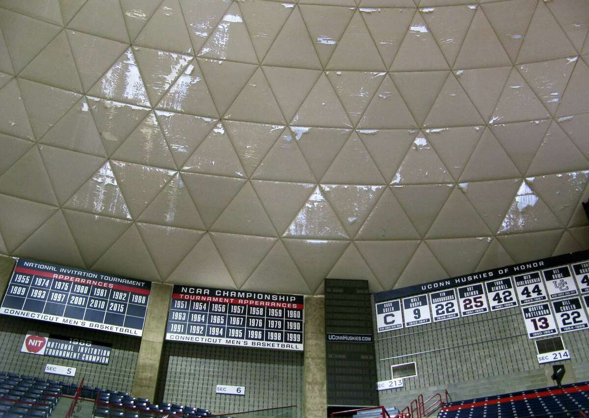 Numerous frayed panels hang in Gampel Pavilion, the University of Connecticut’s basketball arena, Wednesday, March 30, 2016, in Storrs. The school’s board of trustees approved plans to spend $10 million to refurbish the arena’s aging roof, with work scheduled to be completed in October.