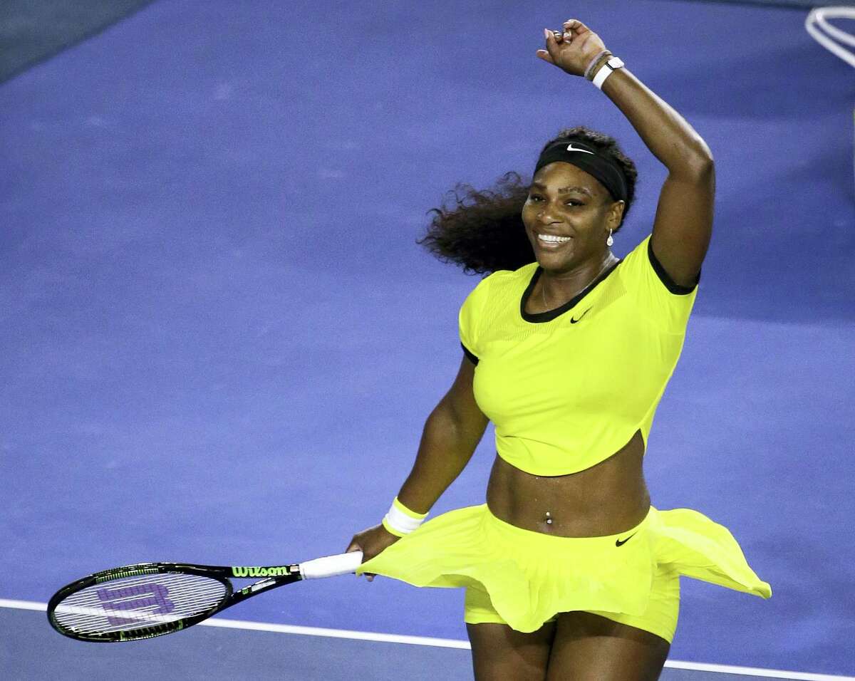 Serena Williams celebrates after defeating Agnieszka Radwanska during their semifinal match at the Australian Open Thursday.