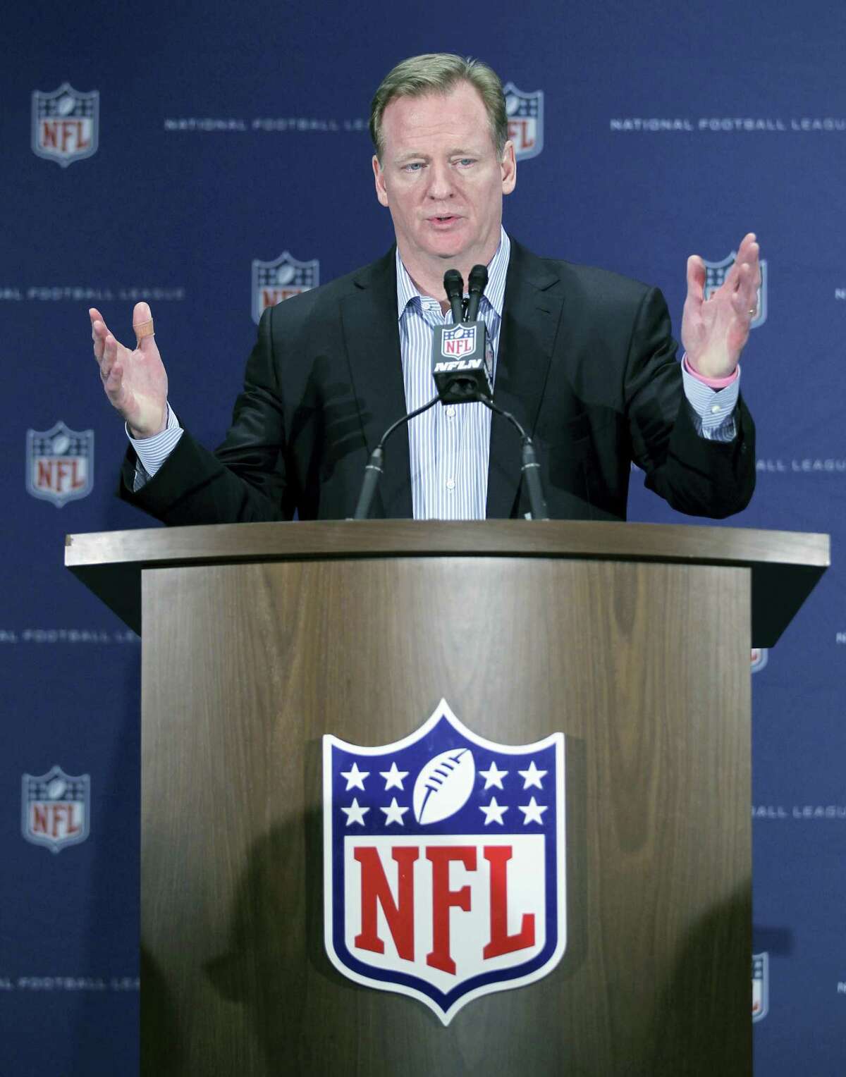 NFL Commissioner Roger Goodell gestures during a press conference. The NFL has demanded The New York Times retract a story that called the league’s concussion research flawed and likened the NFL’s handling of head trauma to the tobacco industry’s response to the dangers of cigarettes. In a letter from its law firm to the general counsels of the newspaper and obtained by The Associated Press on Tuesday, the league said it was defamed by the Times.
