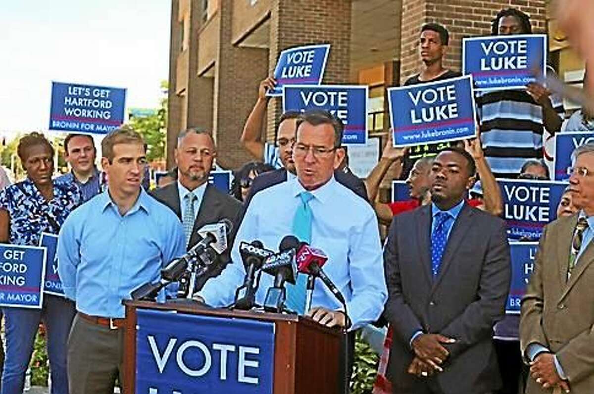 Luke Bronin and Gov. Dannel P. Malloy speak to reporters outside Bronin’s North End campaign office.