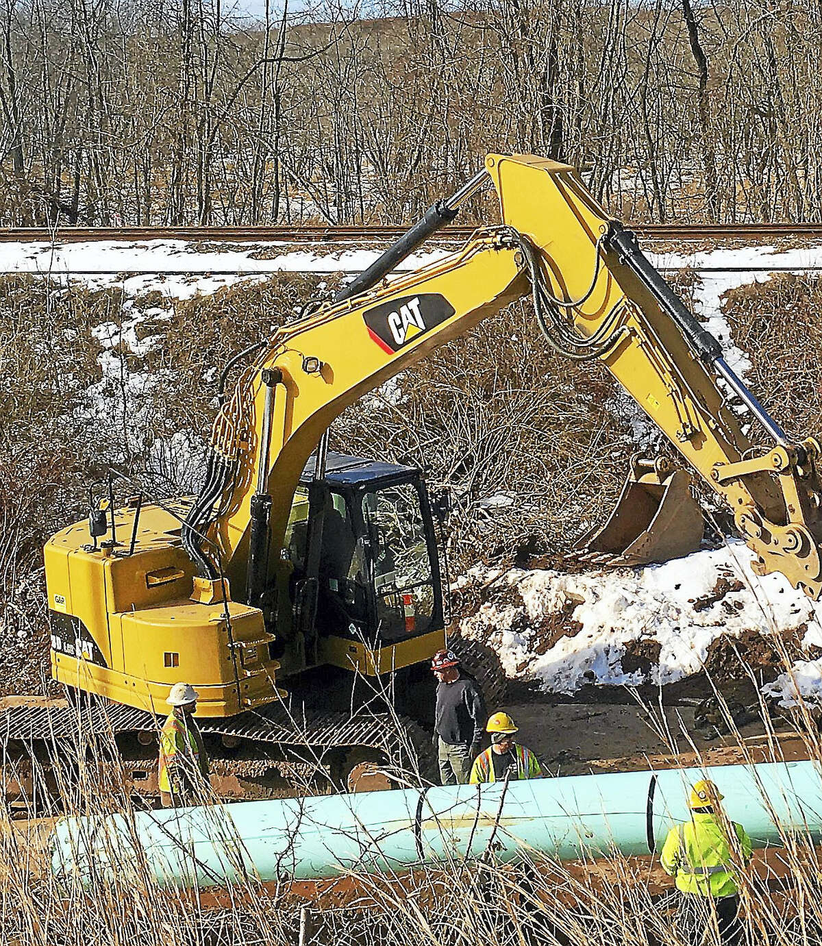 Construction workers can be seen from Route 9 working on the horizontal directional drilling pipe under the Mattabassett River at the Middletown-Cromwell line.