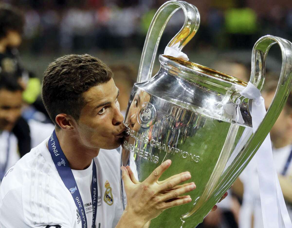Real Madrid’s Cristiano Ronaldo kisses the trophy after the Champions League final on Saturday.