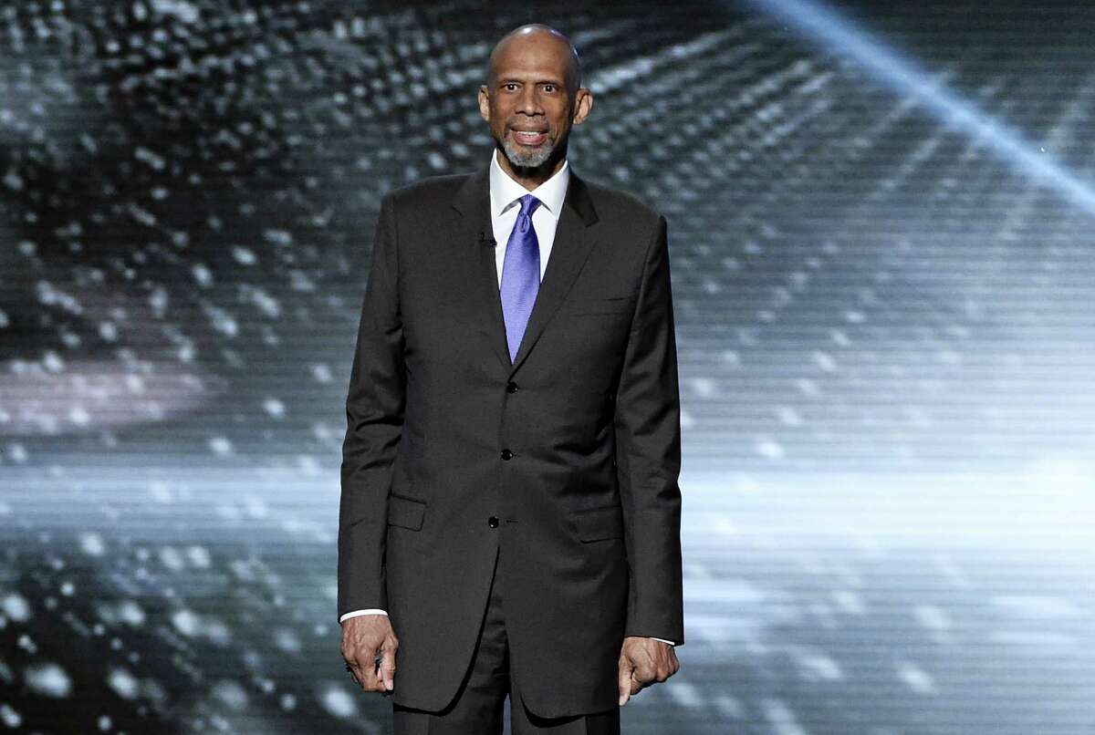 In this July 13, 2016 photo, Kareem Abdul-Jabbar presents a tribute to Muhammad Ali at the ESPY Awards at the Microsoft Theater in Los Angeles. Abdul-Jabbar’s next book will be a fond look back at his long friendship with John Wooden, the celebrated basketball coach at UCLA.