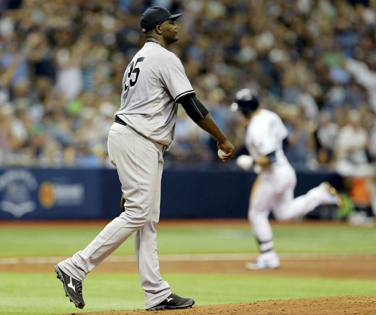 Yankees starting pitcher Michael Pineda walks back to the mound as Evan Longoria rounds the bases after hitting a two-run home run on Saturday.