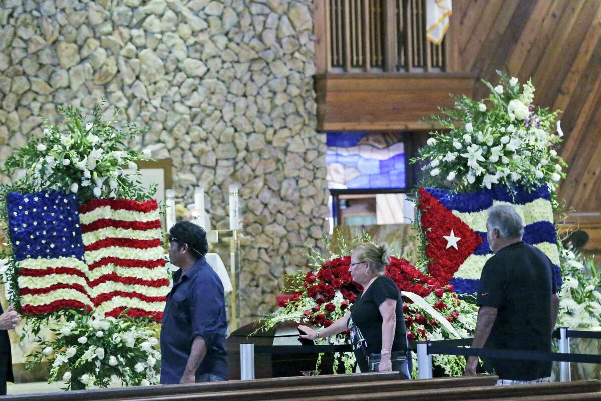 Mourners file past the casket of former Miami Marlins pitcher Jose Fernandez during a memorial service at St. Brendan’s Catholic Church Wednesday.