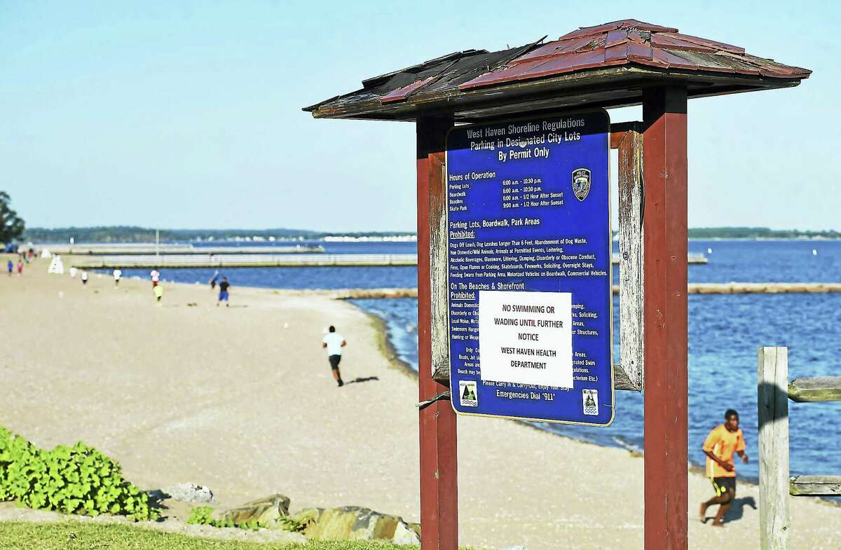 Visitors to the beach in West Haven were not allowed in the water in certain areas Wednesday.