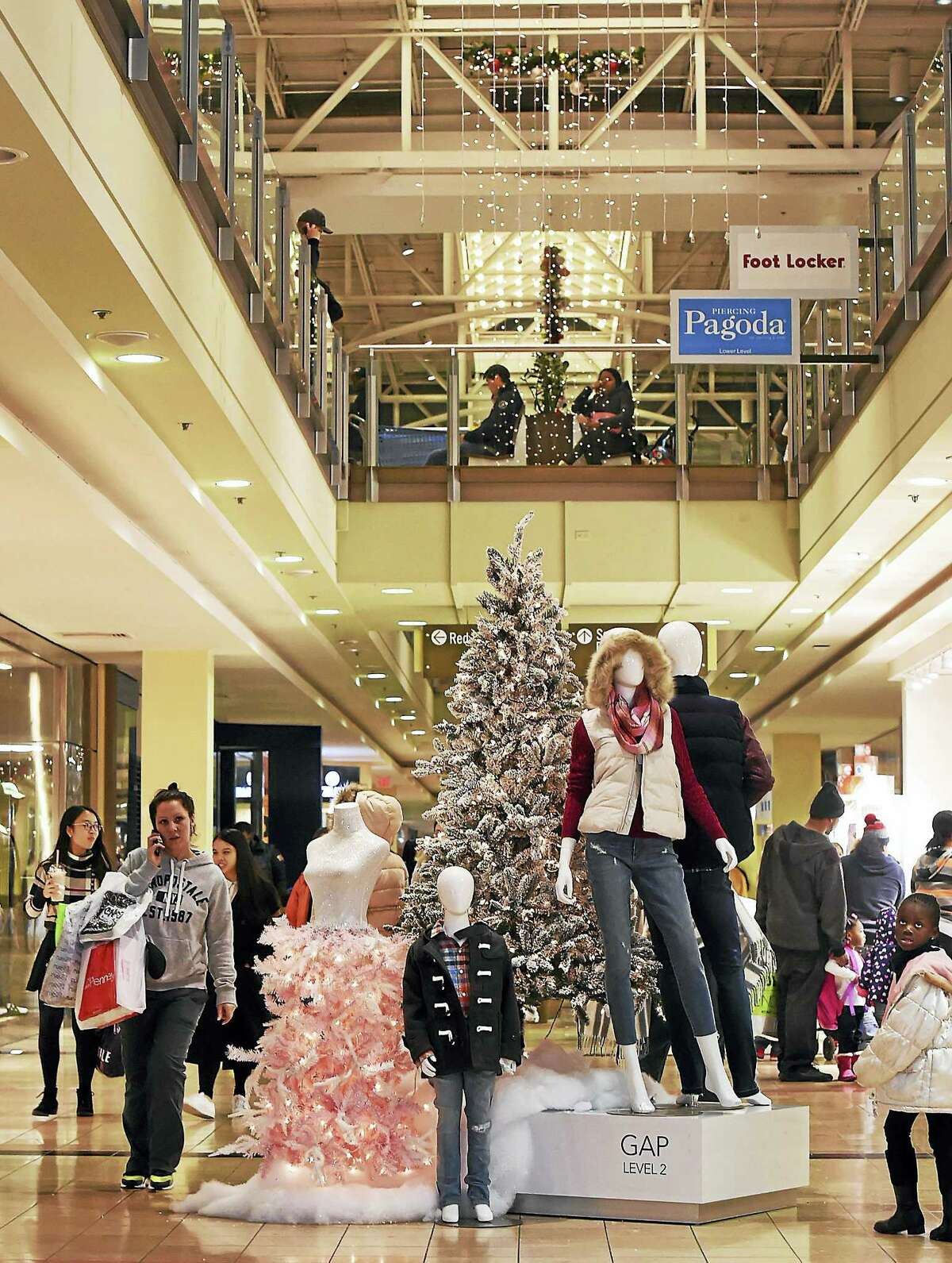 Shoppers stroll through the Connecticut Post Mall in Milford on Black Friday, Nov. 25.