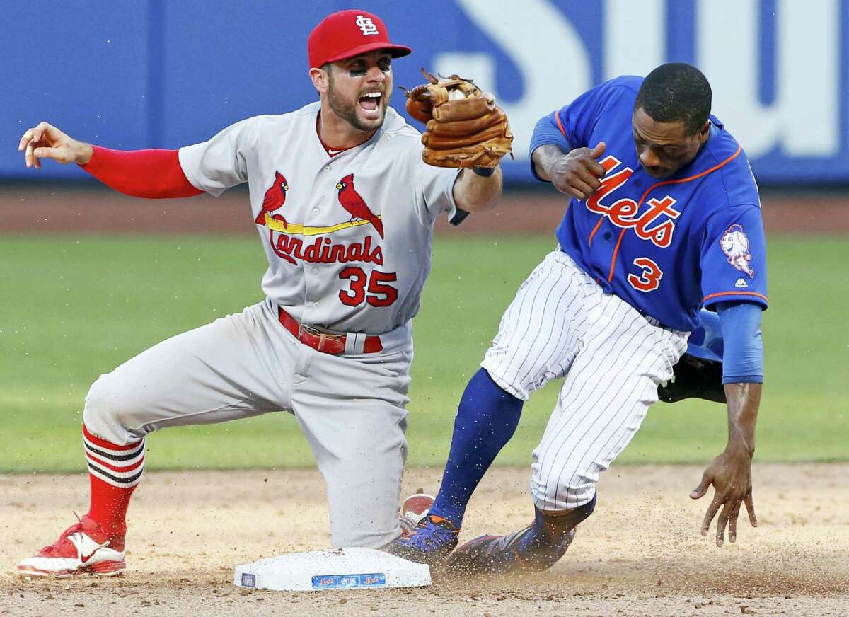 St. Louis Cardinals second baseman Greg Garcia (35) reacts after tagging out New York Mets’ Curtis Granderson (3) on a double play after Yoenis Cespedes flew out to center field during the ninth inning of the first game of a doubleheader Tuesday in New York. The Cardinals defeated the Mets 3-2.