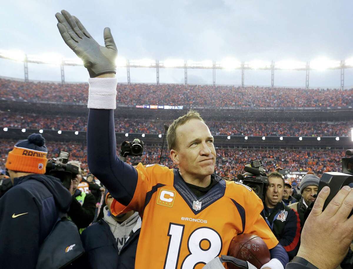 Broncos quarterback Peyton Manning waves to spectators following Sunday’s AFC Championship game.