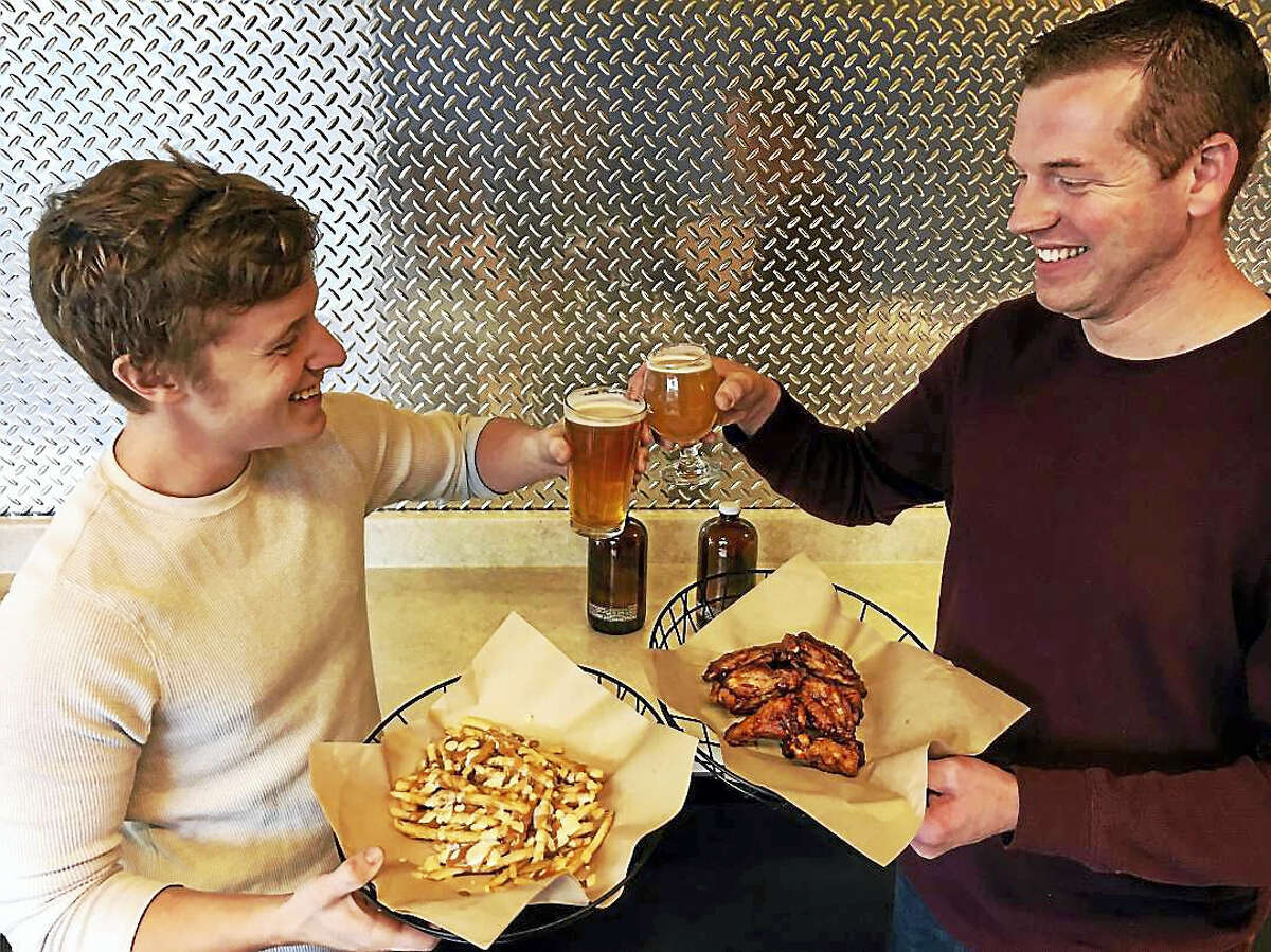 In January, The Hop Knot owners John Schauster, left, and Michael Boney will open a wings restaurant a few doors down in Middletown’s Metro Square plaza on Main Street called Disco Chick.
