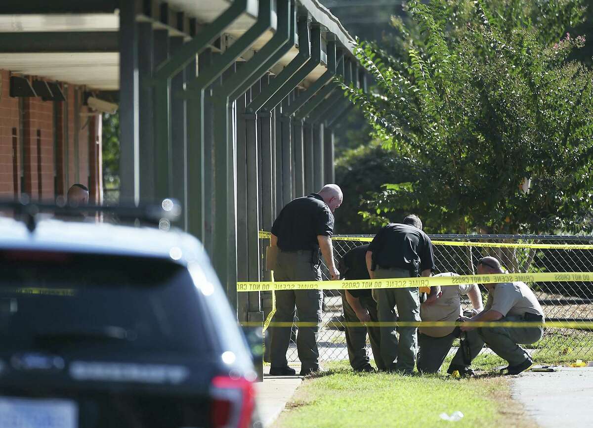 Members of law enforcement investigate an area at Townville Elementary School on Wednesday, Sept. 28, 2016, in Townville, S.C. A teenager opened fire at the South Carolina elementary school Wednesday, wounding two students and a teacher before the suspect was taken into custody, authorities said.