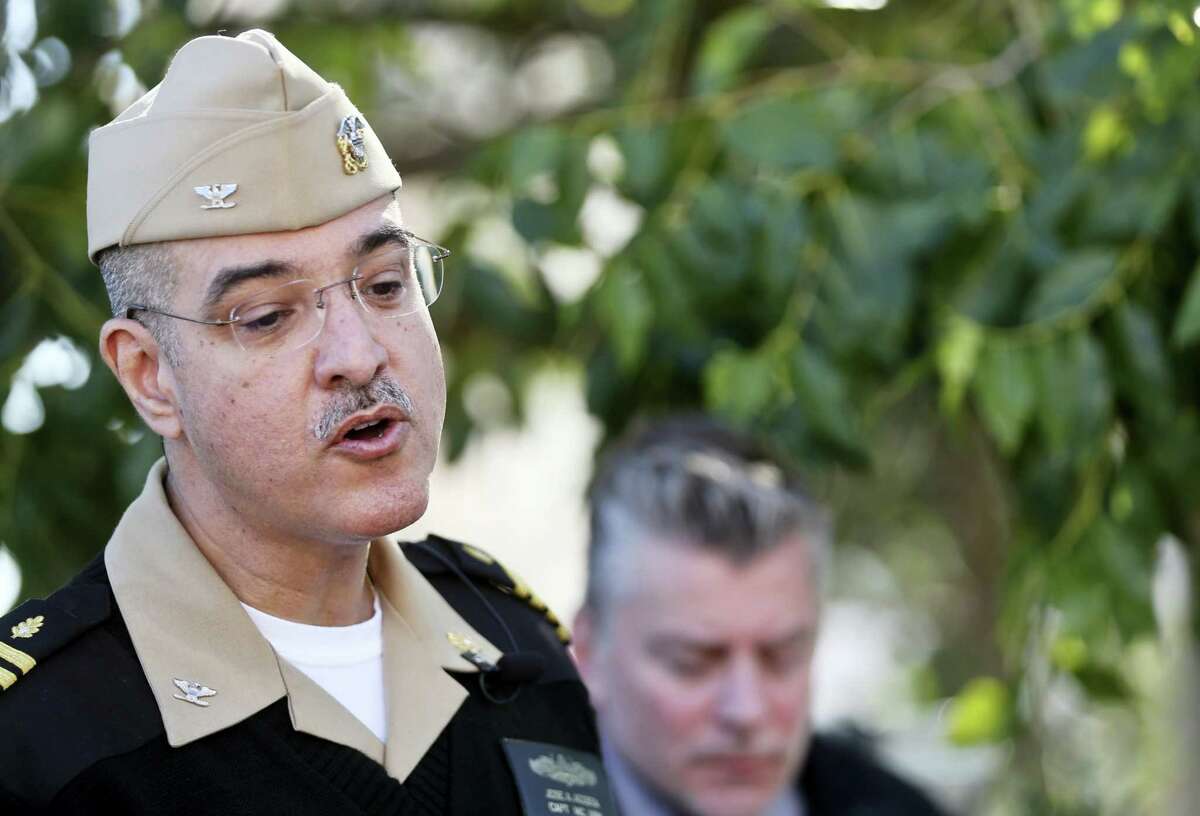 Capt. Jose Acosta speaks to members of the media during a news conference about reports of gunshots at a building on the campus Tuesday, Jan. 26, 2016, in San Diego. The Navy said Tuesday an initial inspection at Naval Medical Center San Diego found no sign of a gunman or a shooting.