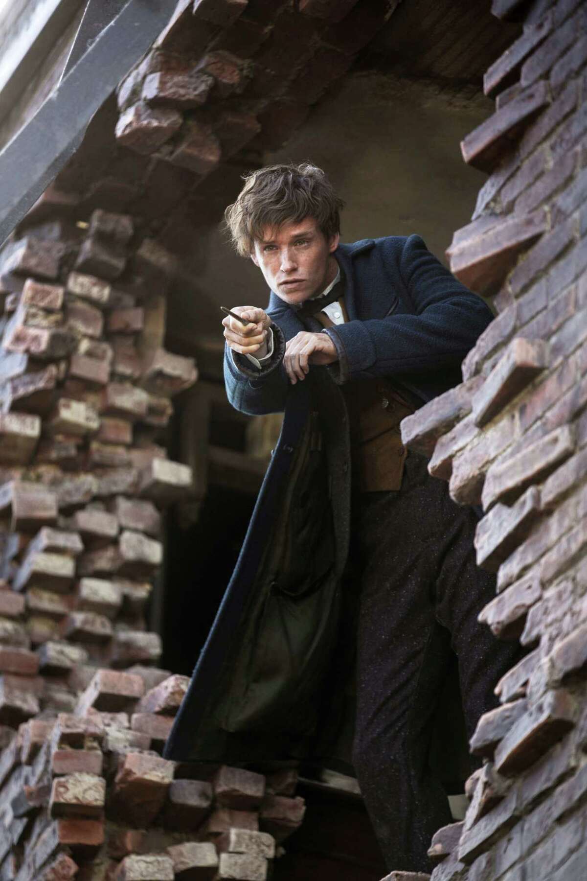This image released by Warner Bros. Entertainment shows Eddie Redmayne in a scene from, “Fantastic Beasts and Where to Find Them.”