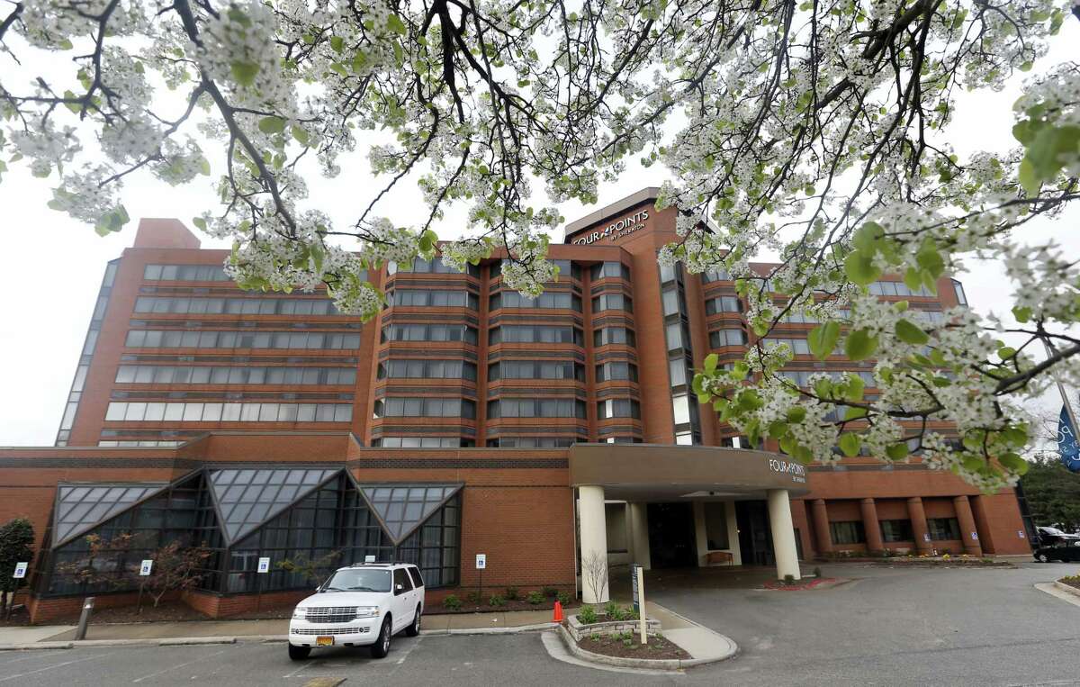 Blossoms frame the Four Points by Sheraton Hotel Friday in Richmond, Va.