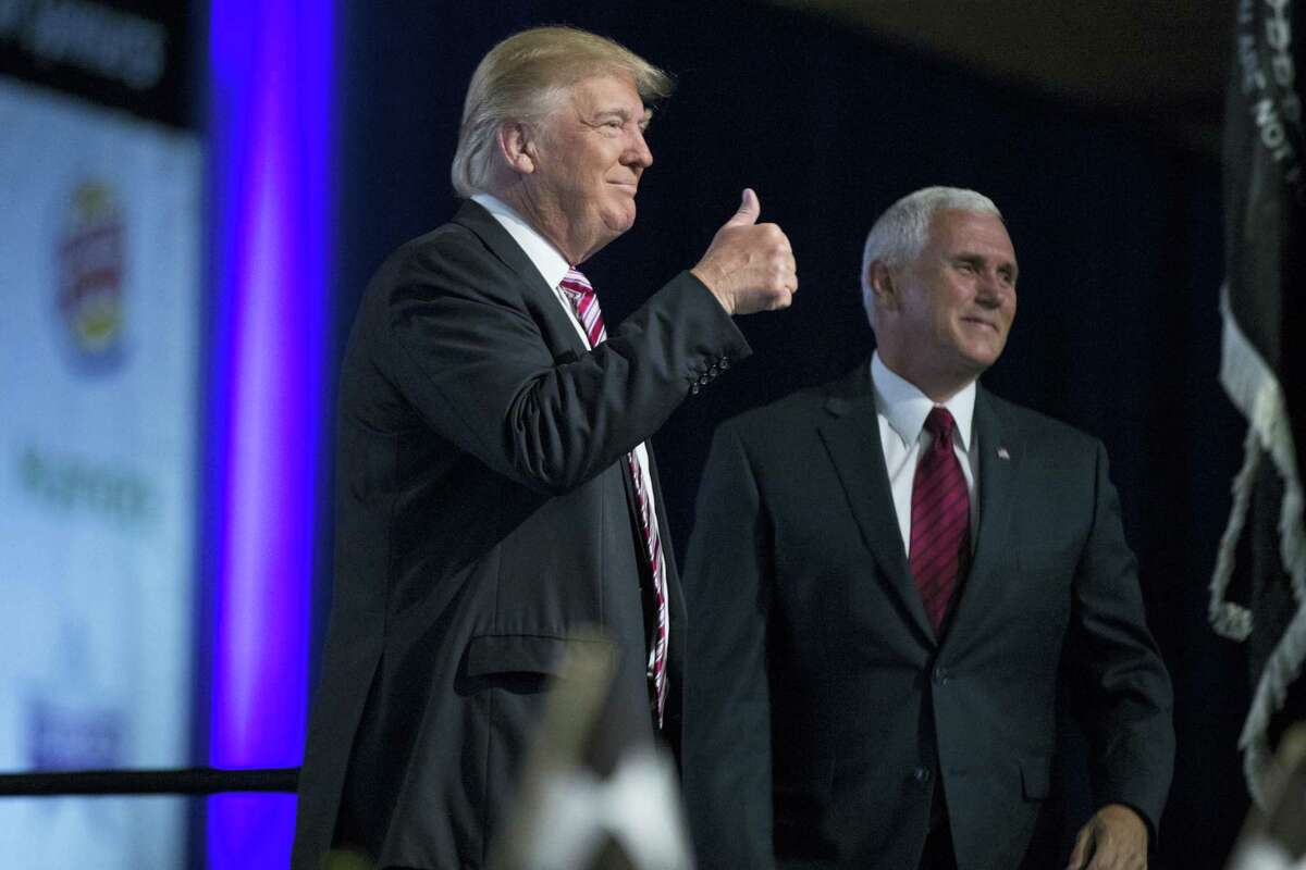 Republican presidential candidate Donald Trump and his running mate, Indiana Gov. Mike Pence, arrive for the Veterans of Foreign Wars convention Tuesday in Charlotte, North Carolina.