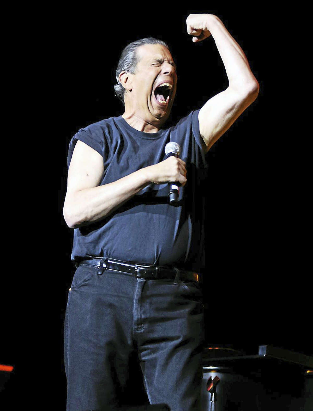 Photo by John Atashian Musician Jon “Bowzer” Bauman, best known as a member of the band Sha Na Na and game show host, makes his classic pose while performing at the Mohegan Sun Arena in Uncasville on Jan. 17. The concert marked the 15th Anniversary of Bowzer’s Rock N’ Doo Wop which featured performances by Little Anthony & the Imperials, Fred Paris & the Five Satins, Jay Siegel’s Tokens, Shirley Alston Reeves of The Shirelles, Paul & Paula, Joey Dee, The Dubs, Johnny Farina of Santo & Johnny and Bowzer & The Stingrays. The concert attracted a capacity crowd of nearly 9,000 fans. To view all upcoming entertainment coming to the Mohegan Sun Casino, visit www.mohegansun.com