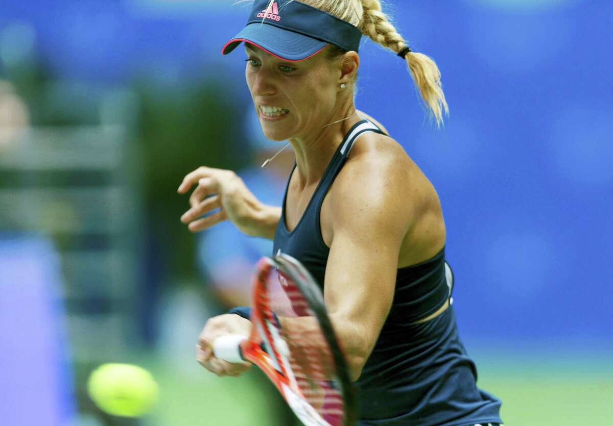Angelique Kerber of Germany hits a return while playing against Kristina Mladenovic of France during the WTA Wuhan Open in Wuhan in central China’s Hubei province on Sept. 27, 2016.