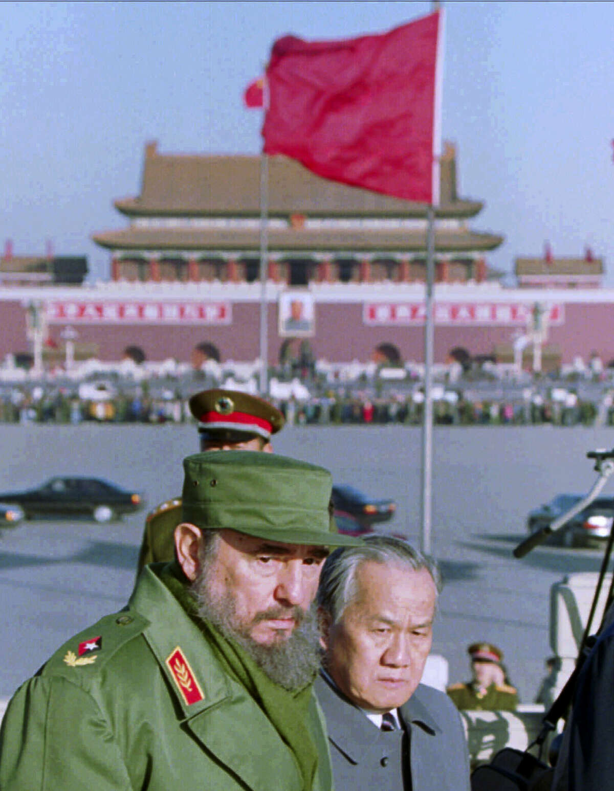 In this Dec. 2, 1995, file photo, Cuban President Fidel Castro tours Beijing’s Tiananmen Square after laying a wreath at the Monument to the People’s Heroes, which commemorates fallen communist revolutionaries. Castro, who led a rebel army to victory in Cuba, embraced Soviet-style communism and defied the power of 10 U.S. presidents during his half century rule, died at age 90 on Friday, Nov 25, 2016. Viewed from the world’Äôs largest communist country, Castro’Äôs death is a reminder of how the communist axis has changed beyond recognition since the ideologically charged era when the bearded revolutionary cut a dashing figure on the world stage alongside leaders like Mao Zedong.