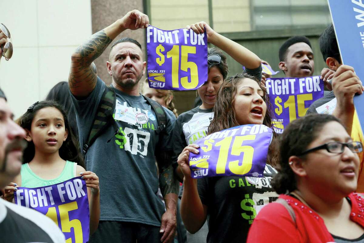 In this July 21, 2015 photo, workers hold a rally in Los Angeles in support of the Los Angeles County Board of Supervisors’ proposed minimum wage ordinance. On March 26, 2016, California legislators and labor unions reached an agreement that will take the state’s minimum wage from $10 to $15 an hour.