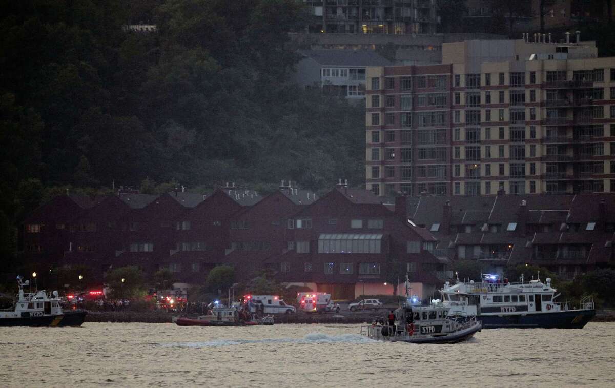 Search and rescue boats look for a small plane that went down in the Hudson River, Friday, May 27, 2016. The Federal Aviation Administration say it received a report a World War II vintage P-47 Thunderbolt aircraft may have gone down in the river two miles south of the George Washington Bridge.