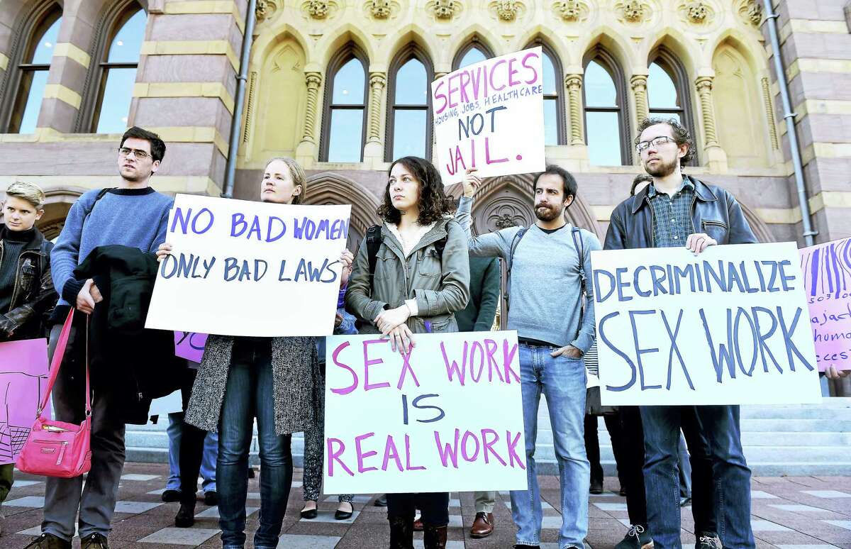 People protest earlier in the month in front of City Hall in New Haven against the arrests of sex workers and the publishing of their names and mug shots in media outlets.