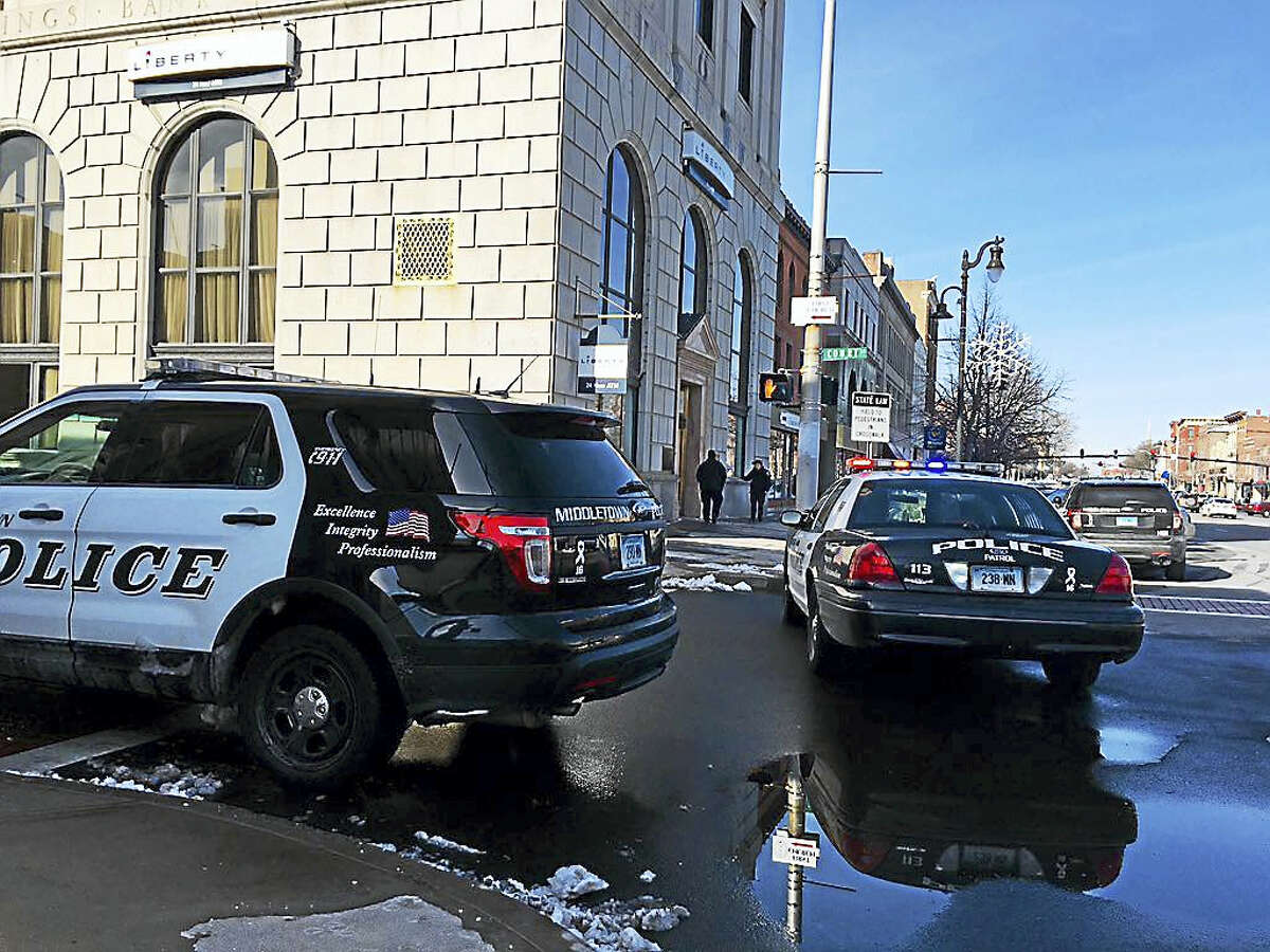 Police converged on Liberty Bank on Main Street Monday morning after a robbery.