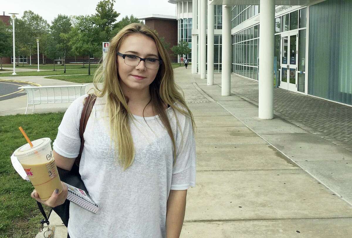 In this Sept. 20, 2016 photo, Manchester Community College student Jeslyn Lamonte, of Vernon, Conn., stands on the school’s campus in Manchester, Conn. She said she intends to transfer to UConn after two years to save on tuition and avoid significant education debt.