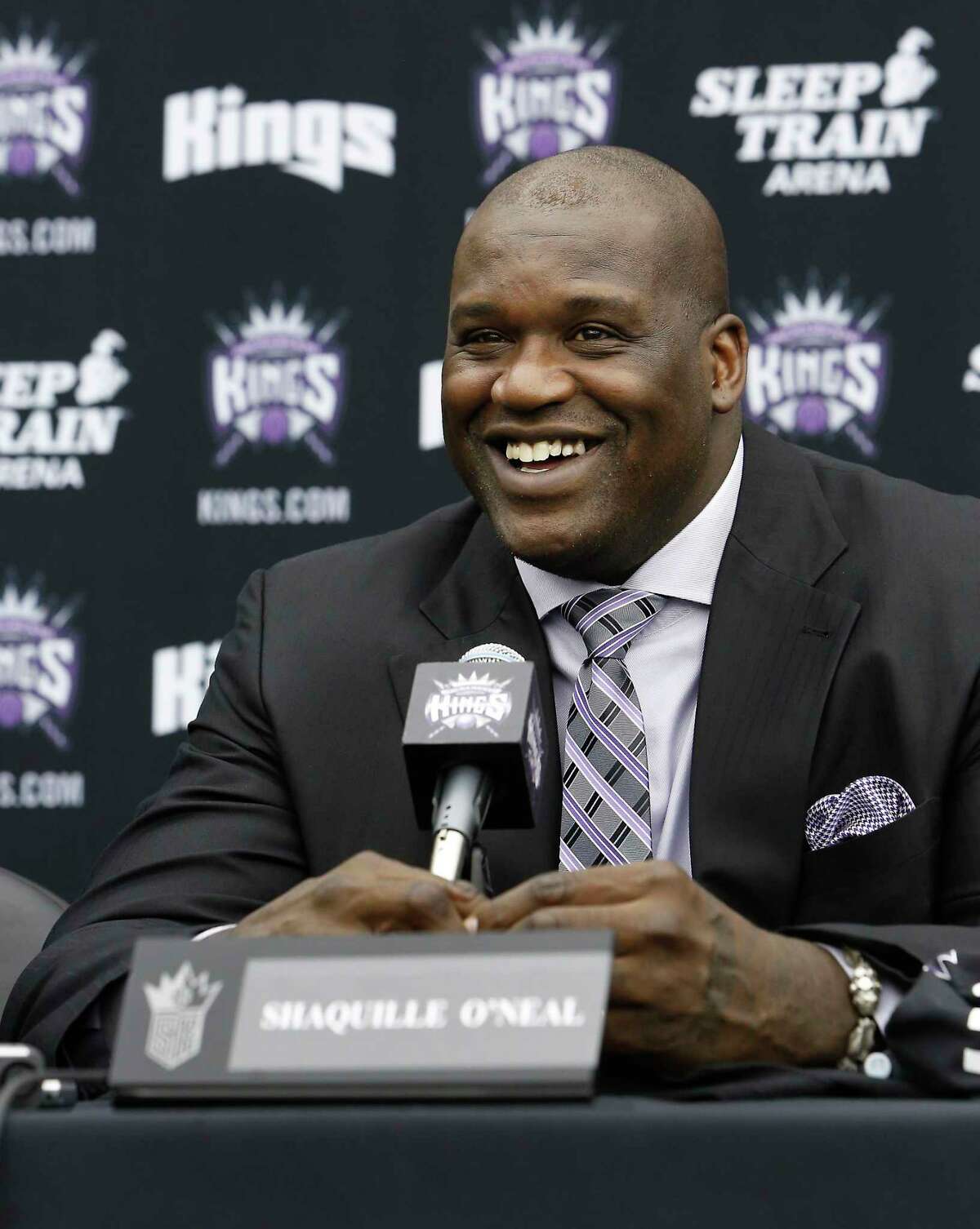 In this Sept. 24, 2013 photo, Shaquille O’Neal smiles during a news conference where he was welcomed as one of the new minority owners of the Sacramento Kings in Sacramento, Calif.