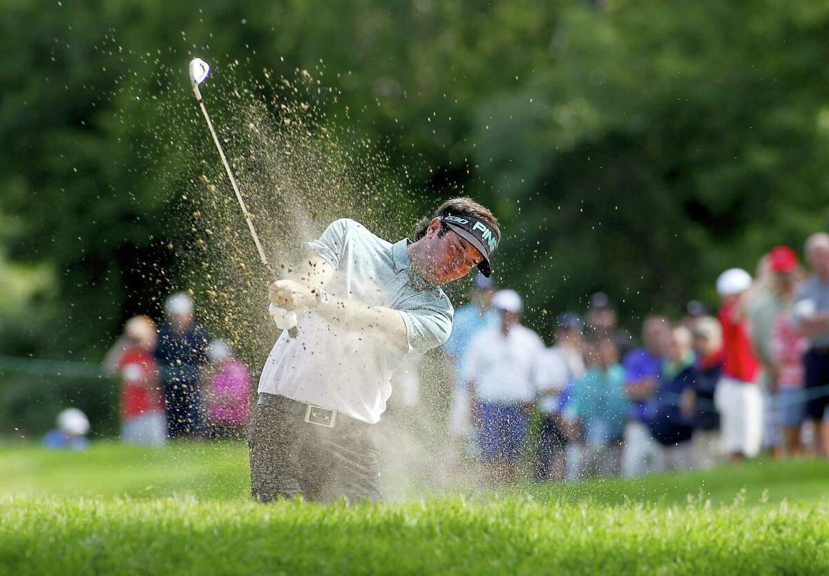 Bubba Watson hits out of a sand trap on the 13th hole during the second round of the Travelers Championship golf tournament last year in Cromwell.