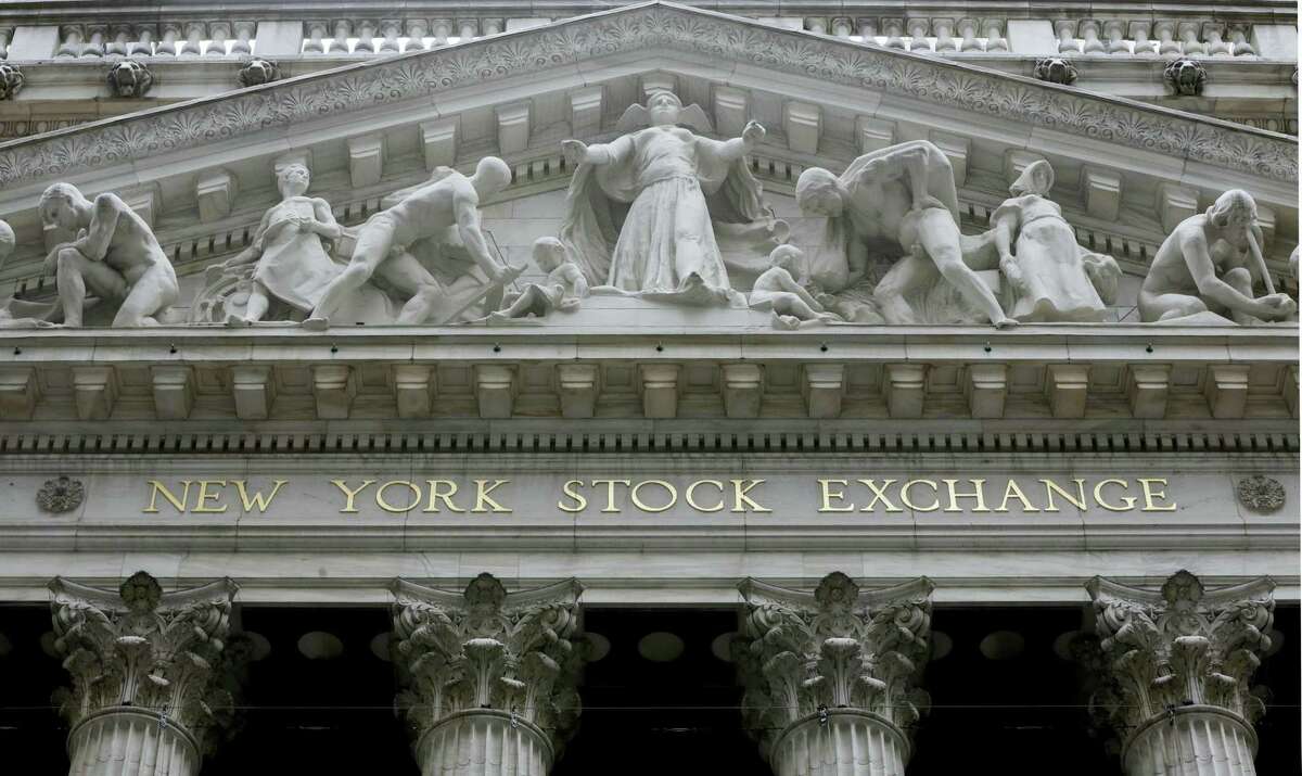 FILE - This Oct. 4, 2014, file photo, shows the facade of the New York Stock Exchange. Stock markets around the world edged higher Thursday, May 26, 2016, as traders interpreted the rise in oil prices to $50 a barrel for the first time this year as a positive sign for the global economy.
