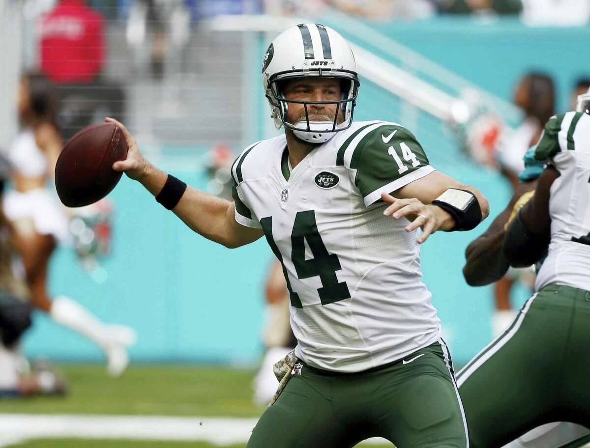 FILE - In this Nov. 6, 2016, file photo, New York Jets quarterback Ryan Fitzpatrick looks to pass during the first half of an NFL football game against the Miami Dolphins in Miami Gardens, Fla. Fitzpatrick will be the Jets’ starting quarterback Sunday, Nov. 27, 2016, against the New England Patriots. (AP Photo/Wilfredo Lee, File)