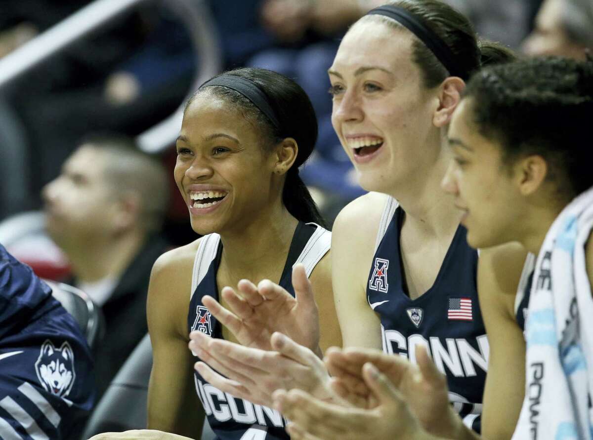 UConn’s Moriah Jefferson, left, and Breanna Stewart cheer from the bench during the second half Saturday,