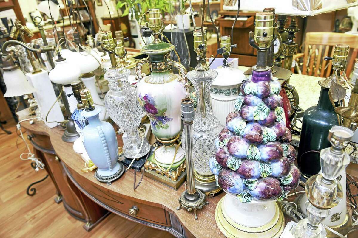 (Arnold Gold-New Haven Register) A display of restored antique lamps at Lamp Shades-Plus in Orange on 7/22/2016.