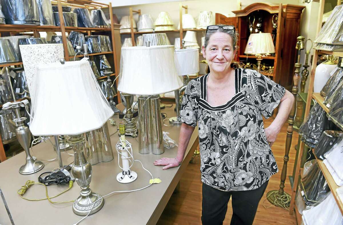 (Arnold Gold-New Haven Register) Jill Pendergast, owner of Lamp Shades-Plus, is photographed at her remodeled store in Orange on 7/22/2016.