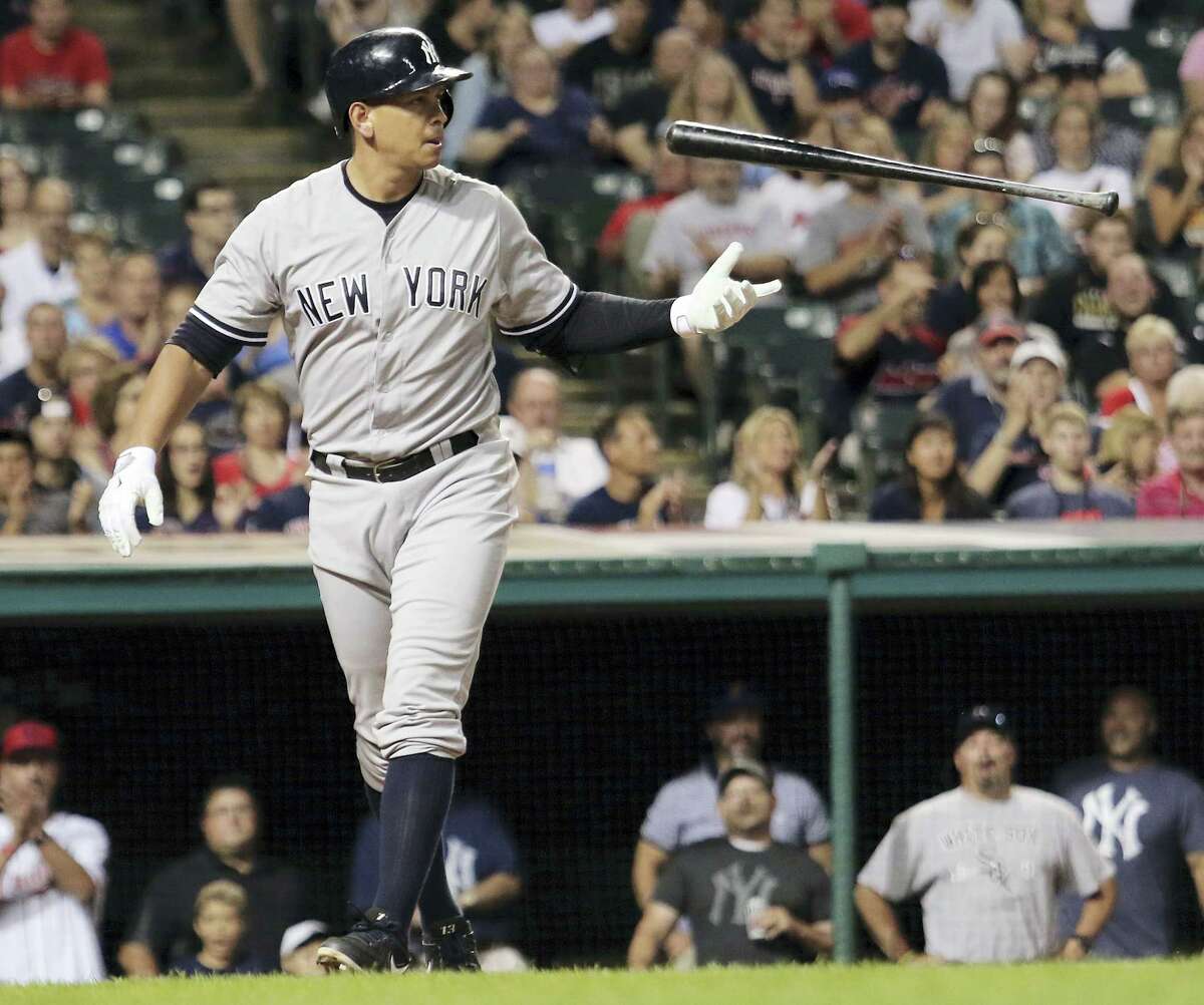 In this Aug. 13, 2015, file photo, Alex Rodriguez flips his bat after striking out in the eighth inning against the Cleveland Indians. Rodriguez says he plans to retire from baseball after the 2017 season. The Yankees slugger revealed his intentions during an interview with ESPN.