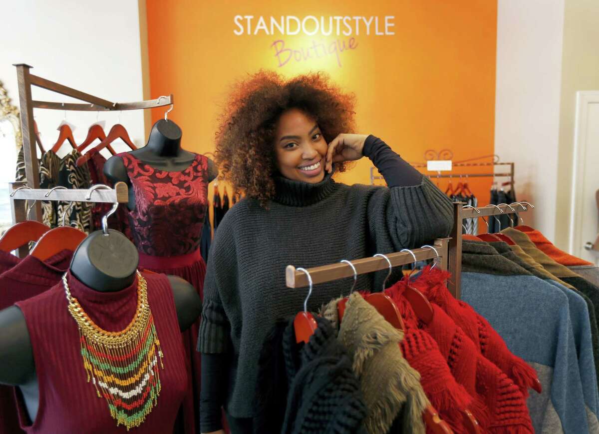 Tamika Maria Price poses for a portrait at her business, Standout Style Boutique, in Chicago’s Lakeview neighborhood. A disappointing holiday shopping season has small and independent retailers thinking about how to get customers interested in shopping in 2016.
