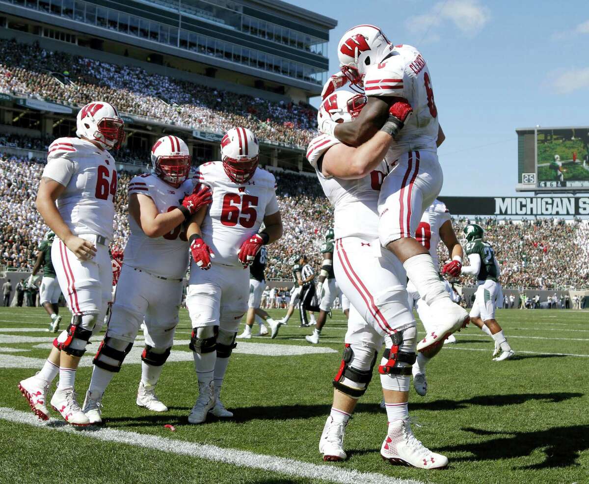 Wisconsin moved up to No. 8 in the latest college football AP Top 25 poll.