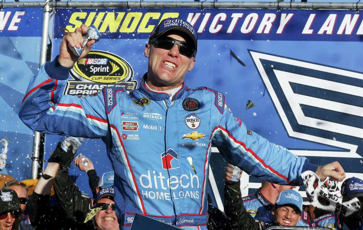 Kevin Harvick celebrates in Victory Lane after winning at New Hampshire Motor Speedway on Sunday.