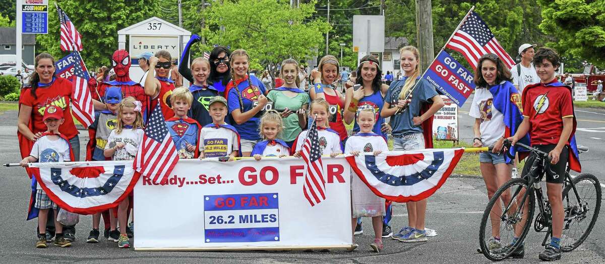 Go Far, Go Fast founder Jennifer Schulten (far left) of Middlefield is among six winners of the 2016 John Wentworth Good Sports Award given by the Connecticut Sports Writers’ Alliance. Here, those who took part in the Memorial Day 2015 superheros-themed race are members of the popular running group that operates in several Regional School District 13 schools.