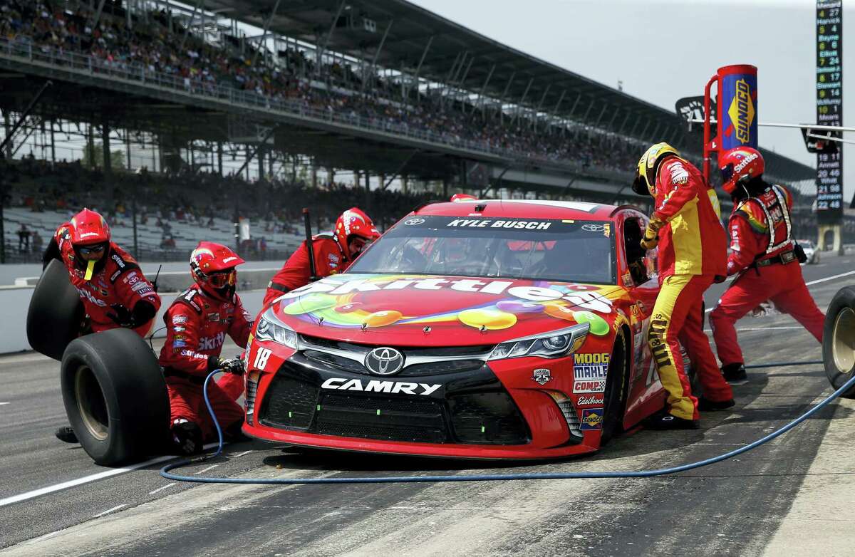 Kyle Busch makes a pit stop during the Brickyard 400 at Indianapolis Motor Speedway on Sunday.