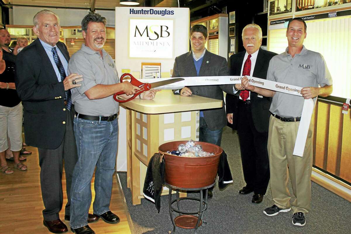 Middlesex Shades and Blinds held a grand opening Sept. 22 with Middletown city and business officials at Main Street Market, 386 Main St. From left are President of the Middlesex County Chamber of Commerce Larry McHugh, co-owner Mike Uliano, Middletown Mayor Dan Drew, Middletown Small Business Development Counselor Paul Dodge and co-owner Vincent Carta.