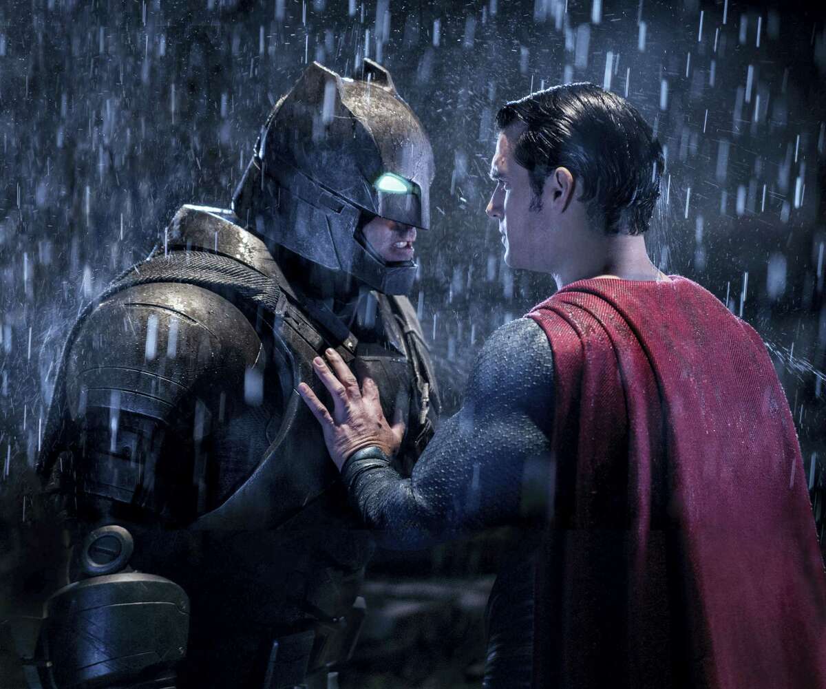 This image released by Warner Bros. Entertainment shows Ben Affleck as Batman, left, and Henry Cavill as Superman in a scene from, “Batman V. Superman: Dawn Of Justice.”