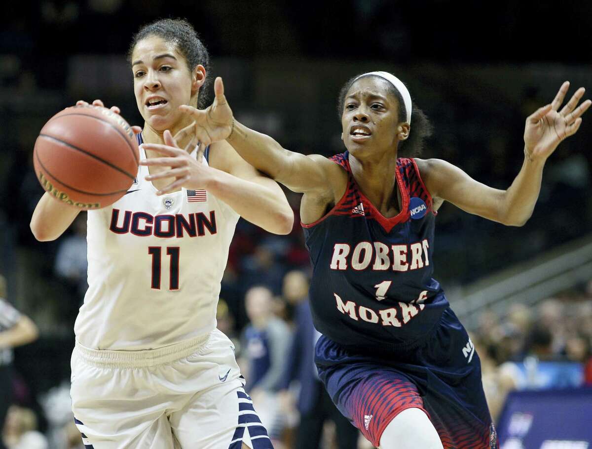 Connecticut’s Kia Nurse, left, steals the ball from Robert Morris’ Jocelynne Jones, right, during a first round women’s Saturday in Storrs.